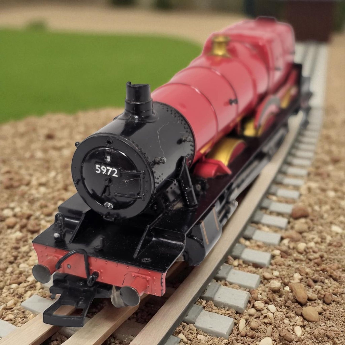 Model train on a track with a blurred background