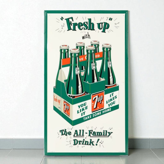 Vintage-style poster advertising 7-Up soda with a green frame.
