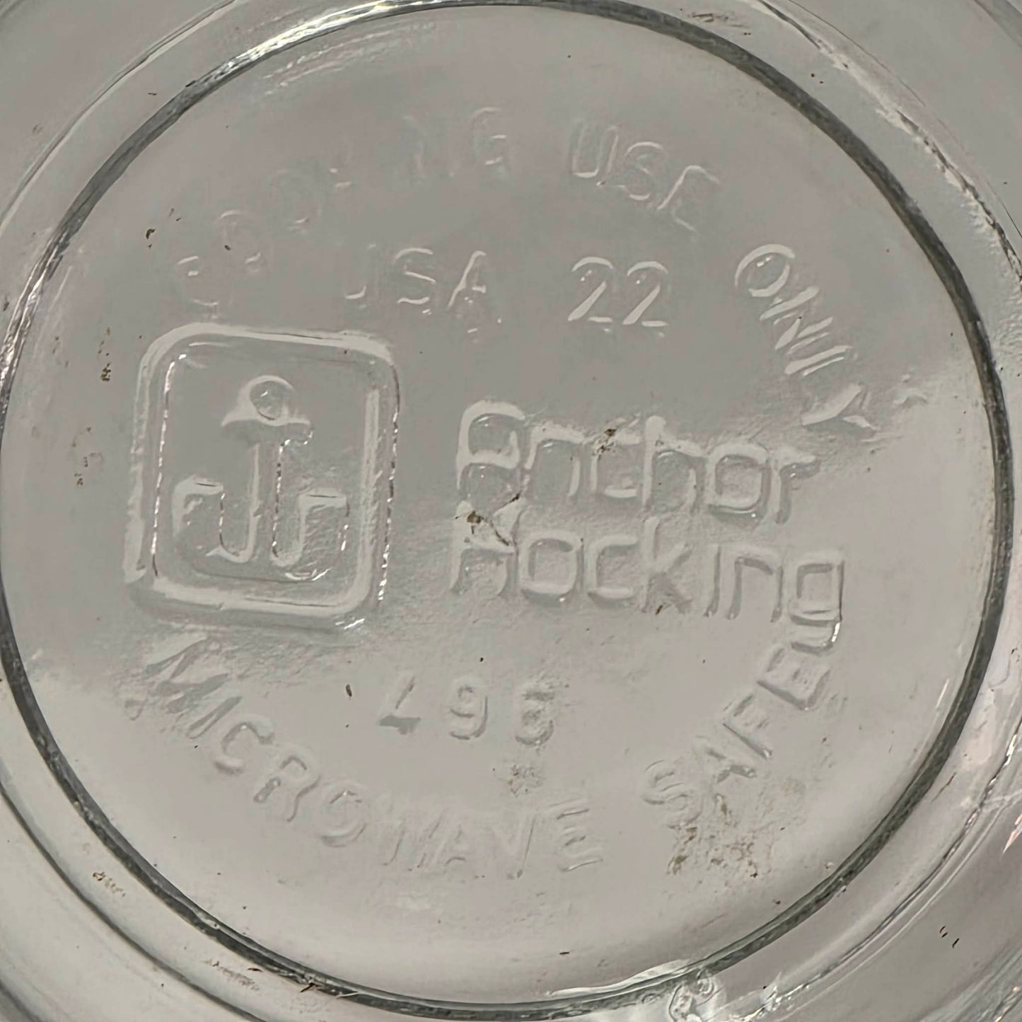 Vintage Anchor Hocking glass measuring cup with Imperial and metric measurements.