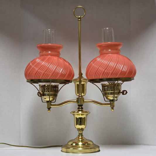 Stunning Victorian brass lamp with pastel pink swirled glass shades.