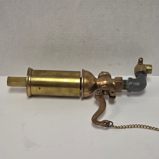Antique Pemberthy brass steam whistle with iron pipe fitting