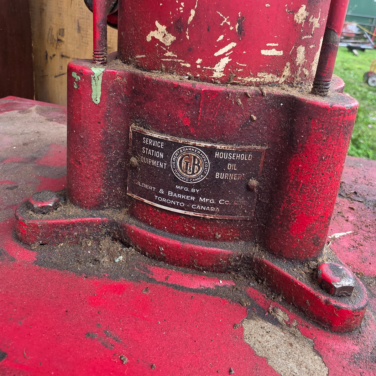 Antique Esso-branded lubester oil tank with Gilbert and Barker brass identification tag