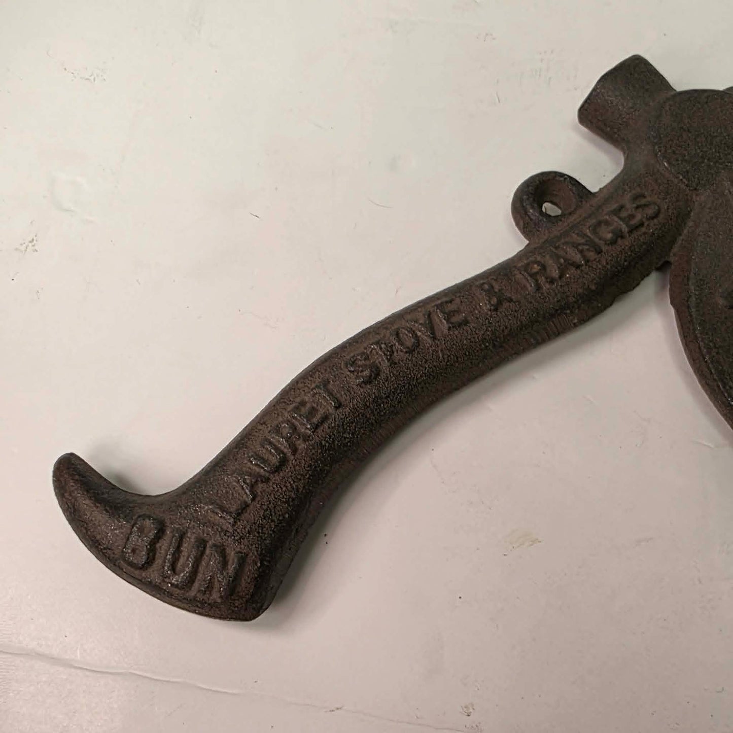 Early 1900s cast iron Carrie Nation temperance advertising axe with detailed relief portrait and slogan.