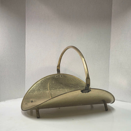 A beautiful vintage brass log holder that keeps firewood organized while adding classic elegance to your hearth.