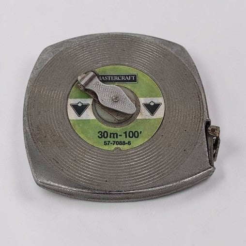 Metal tape measure with 'Mastercraft' branding on a white background