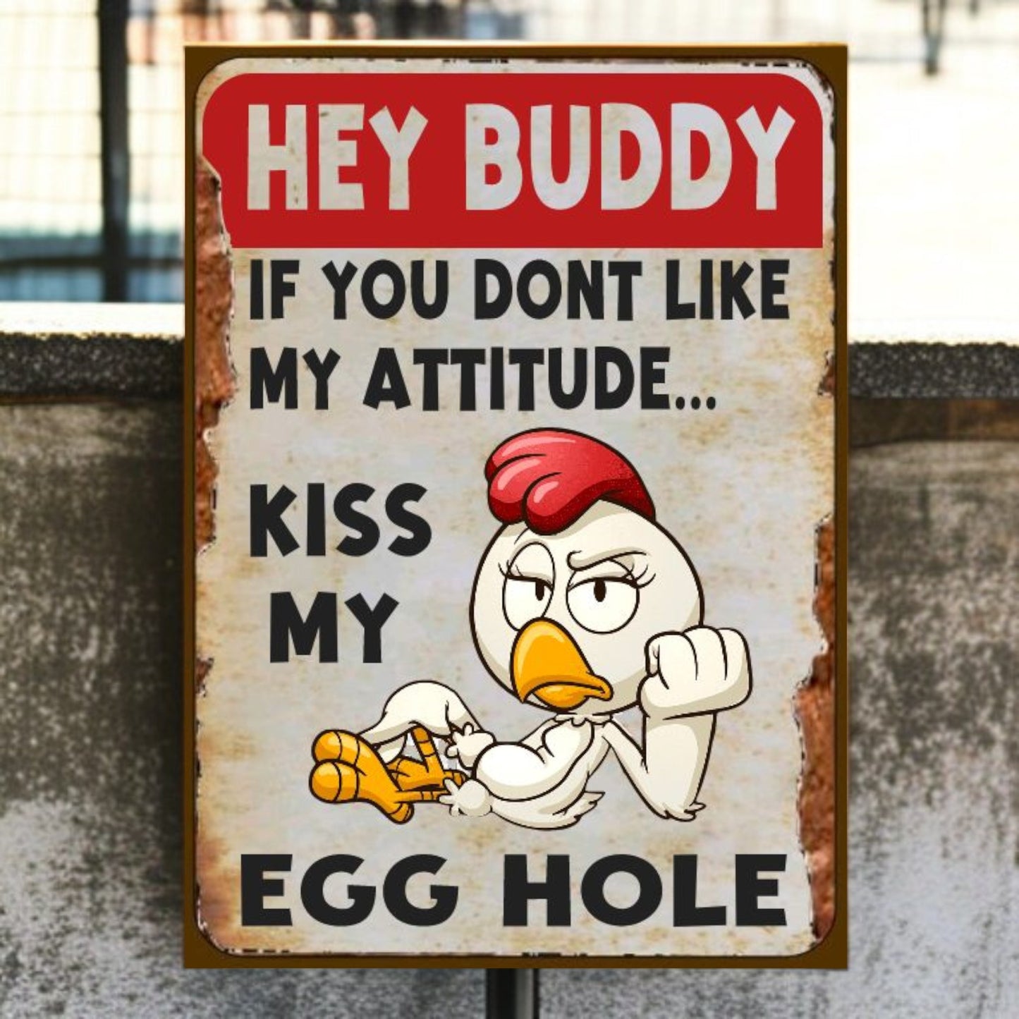 Cartoon chicken with humorous text on a metal sign