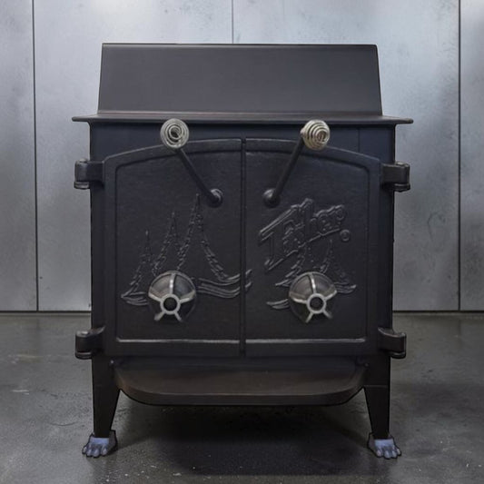 Fisher Grandma Bear wood stove with cathedral style doors and rear vent chimney cooking surface.