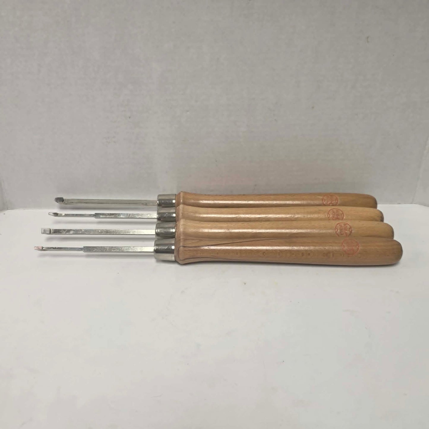 A rare vintage ShopSmith woodturning chisel set in excellent condition, featuring four specialty turning tools.