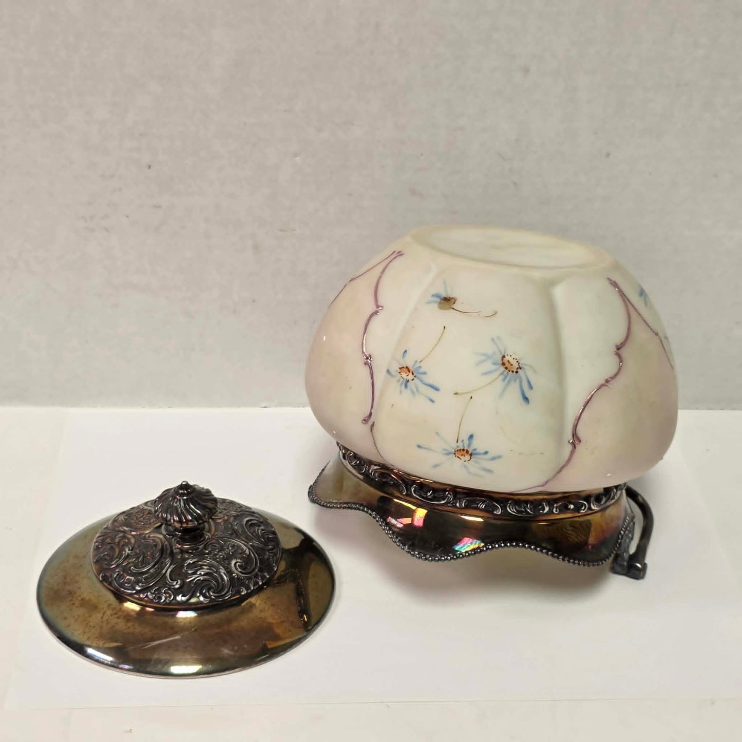 Victorian Mount Washington biscuit barrel with pastel pink and blue floral glass and ornate handle.