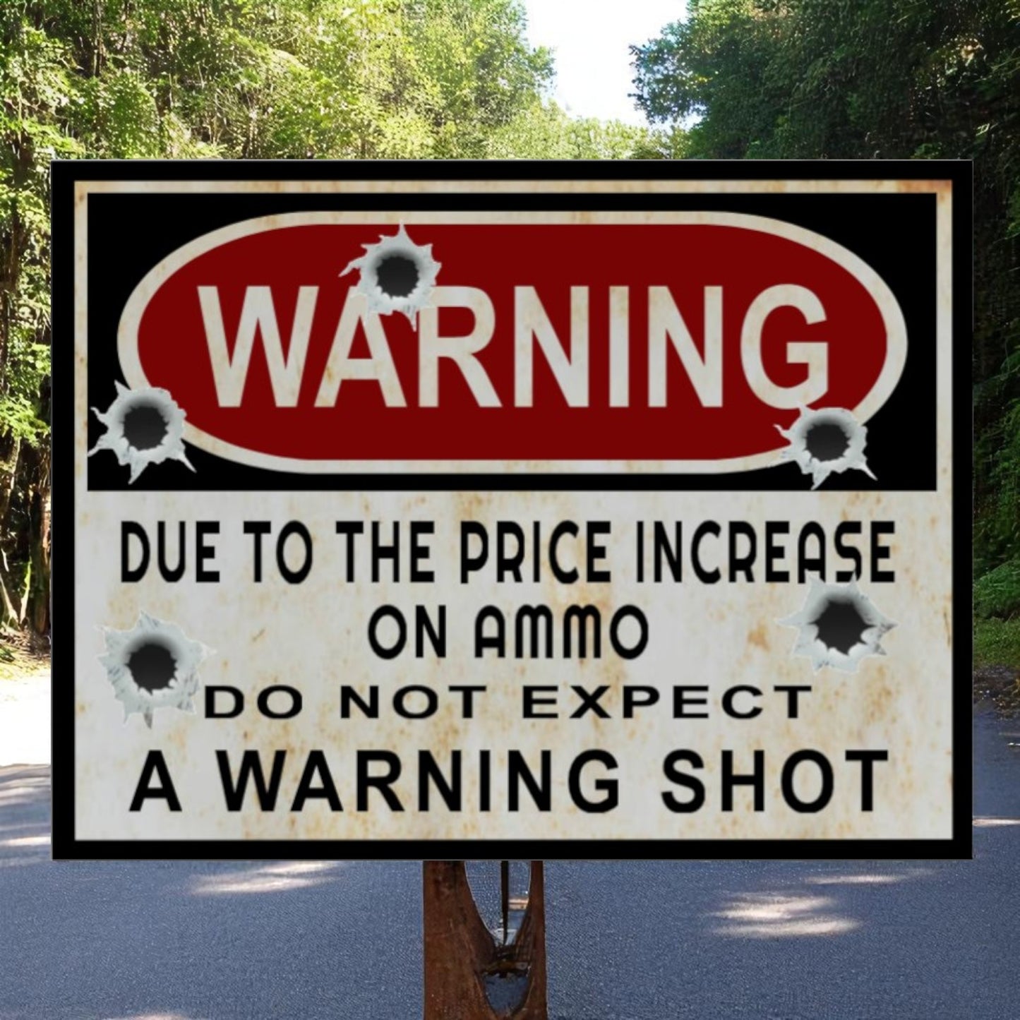 Warning sign with bullet holes on a road with trees in the background