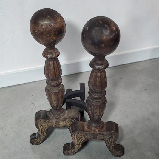 Pair of antique Arts and Crafts cast iron fireplace andirons.