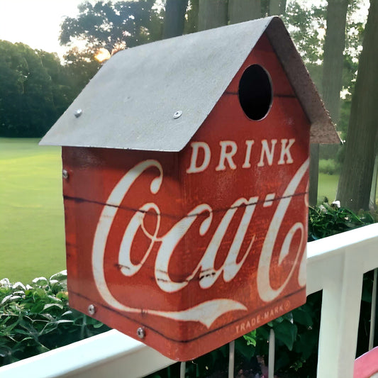 Handcrafted Coca-Cola birdhouse with reclaimed wood, galvanized roof, and Drink Coca-Cola metal walls.