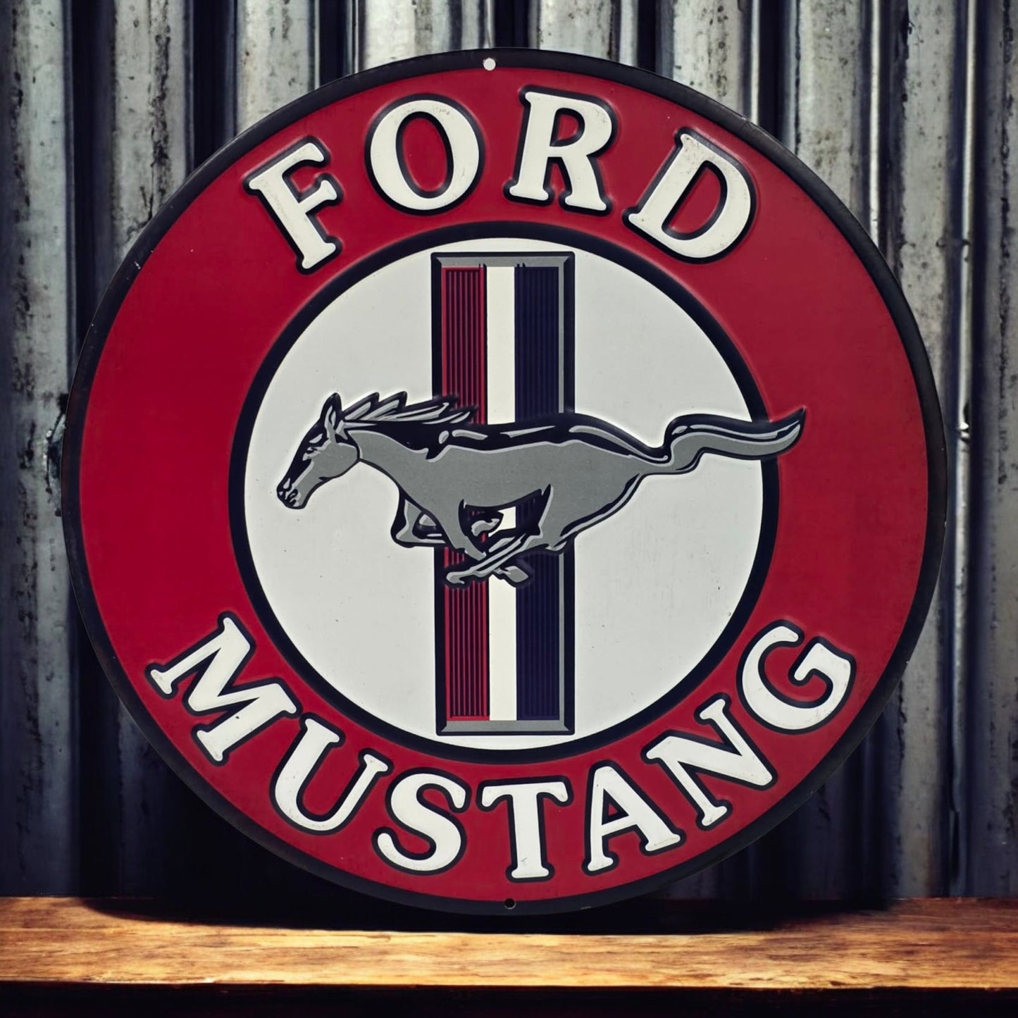 Ford Mustang logo on a round sign with a wooden surface and metal wall background