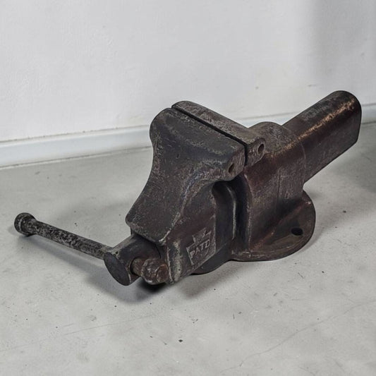 Vintage heavy duty blacksmith style bench vise with 4 inch jaws.