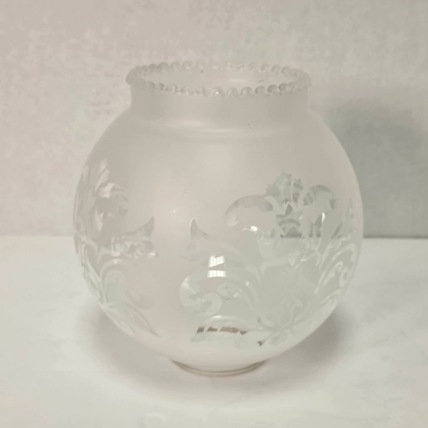 Vintage brass hurricane candle holder with elegant etched glass globe.