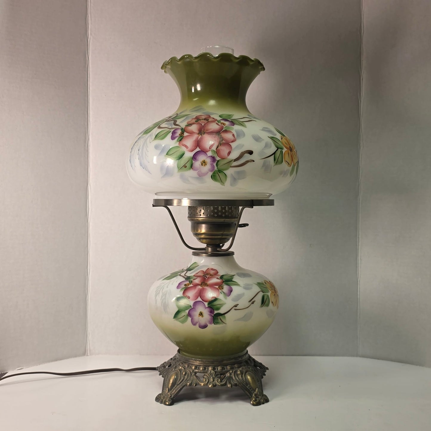 Vintage hurricane lamp with pastel hand-painted floral glass and dual lighting feature.