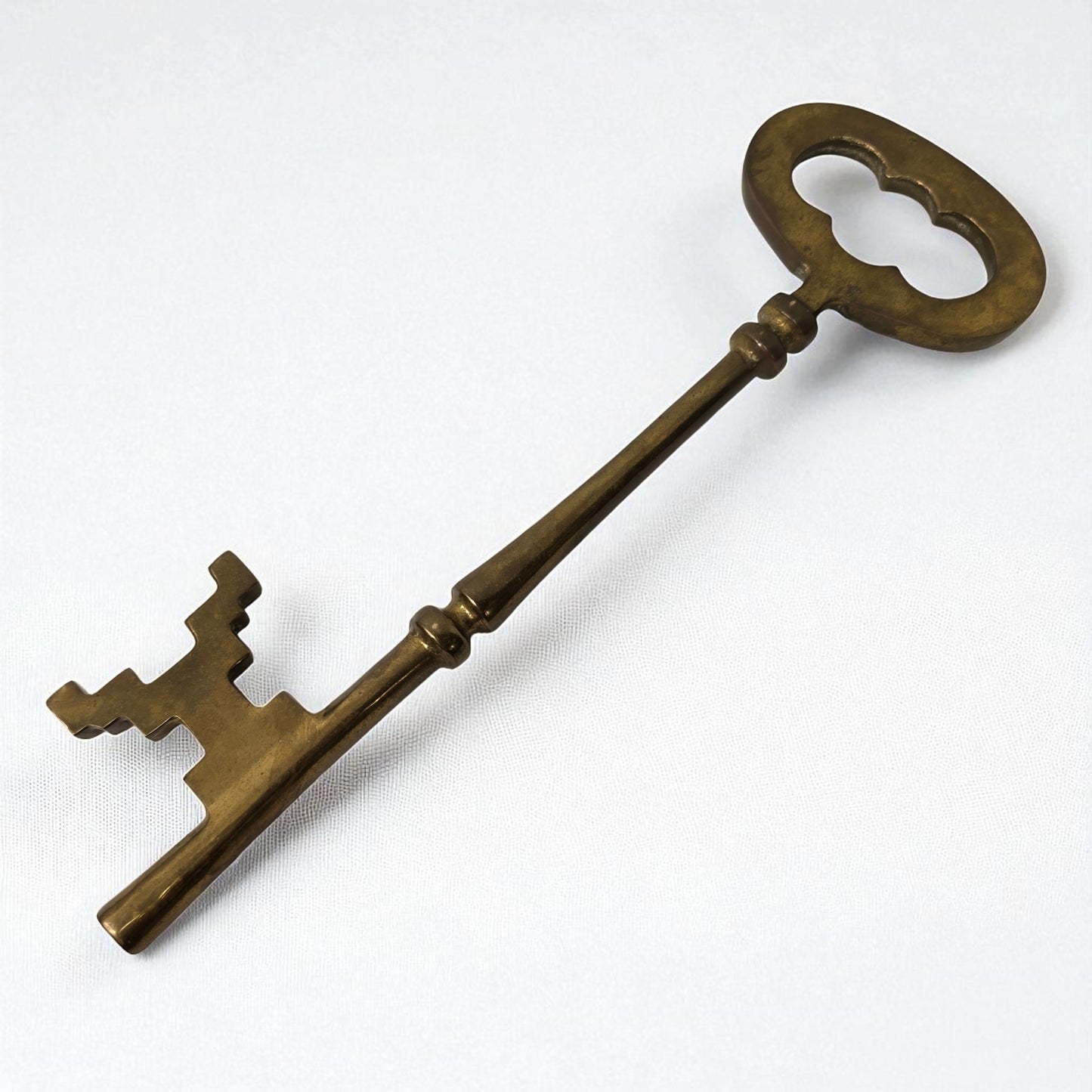 Bronze skeleton key on a white background