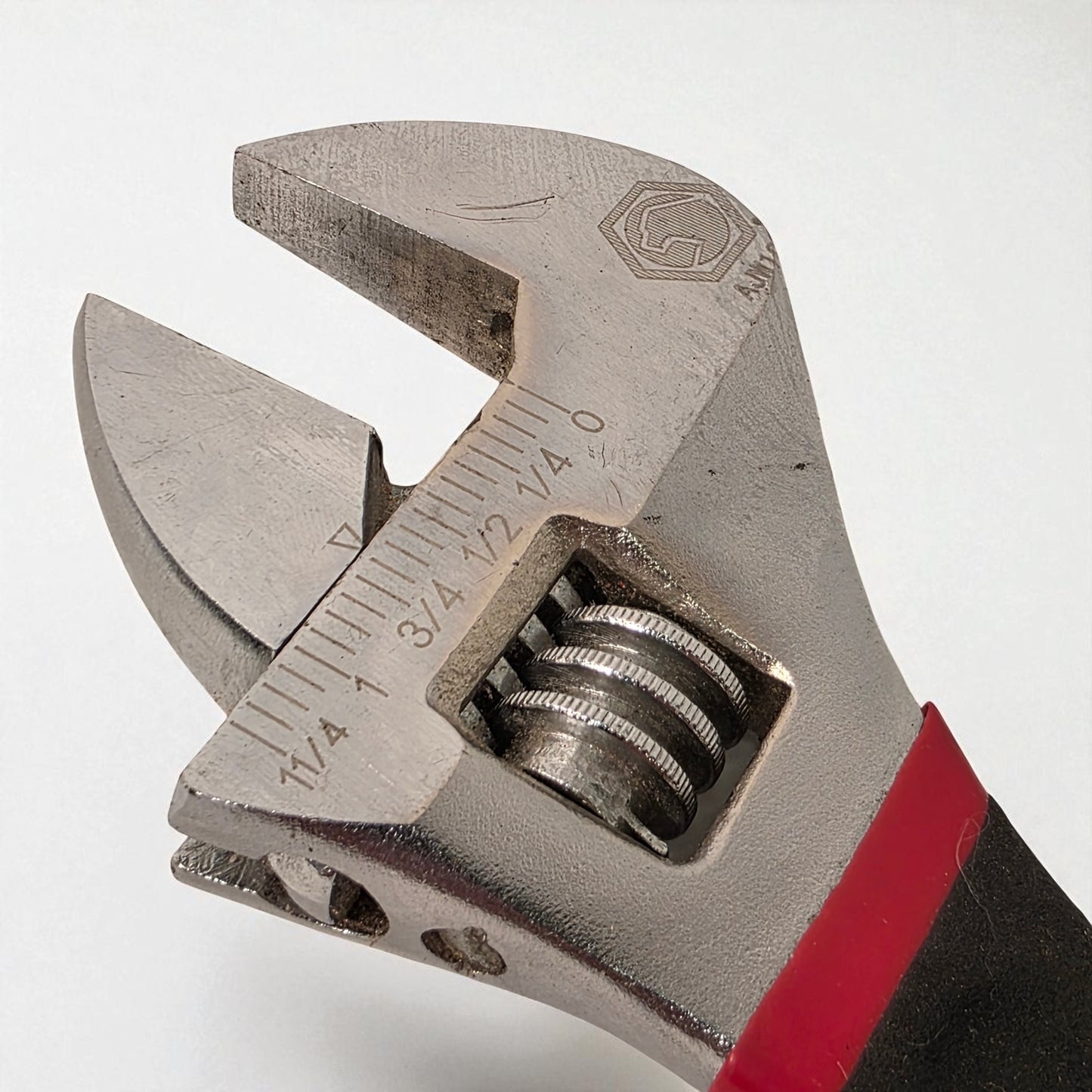Adjustable wrench with measurement scale on a white background