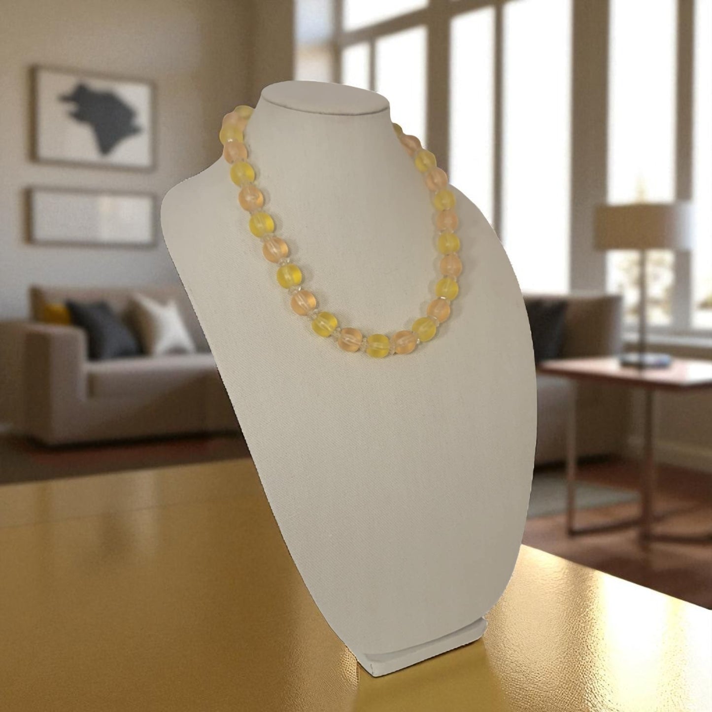 Necklace on a mannequin bust in a living room setting