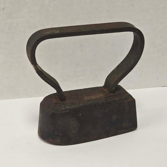 Late 19th-century antique tugboat-style cast iron sad clothes iron from Troy New York.