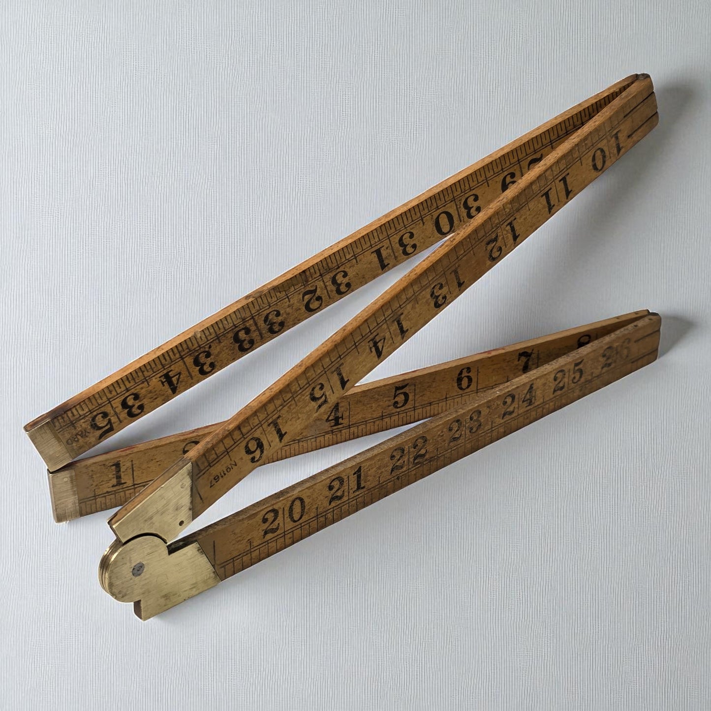 Wooden folding ruler on a light gray background