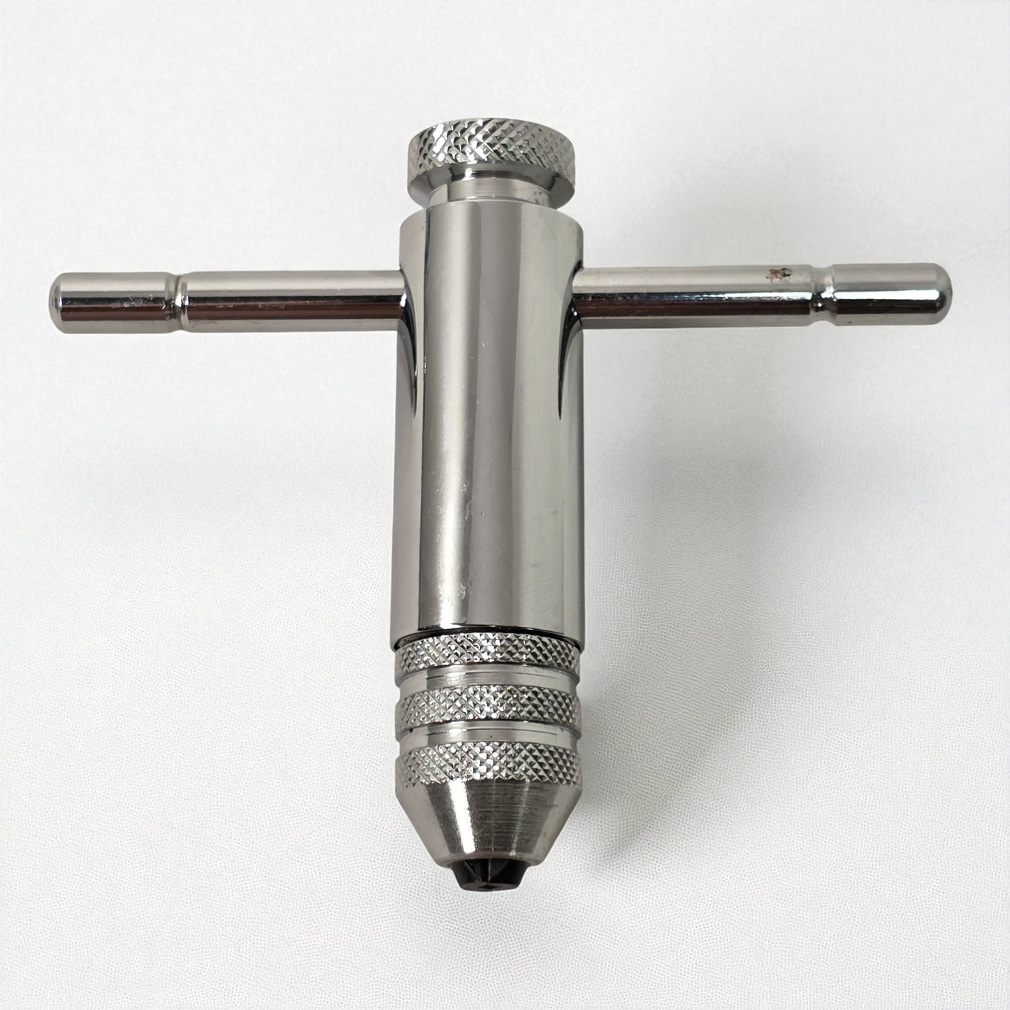 Metal drill bit holder on a white background