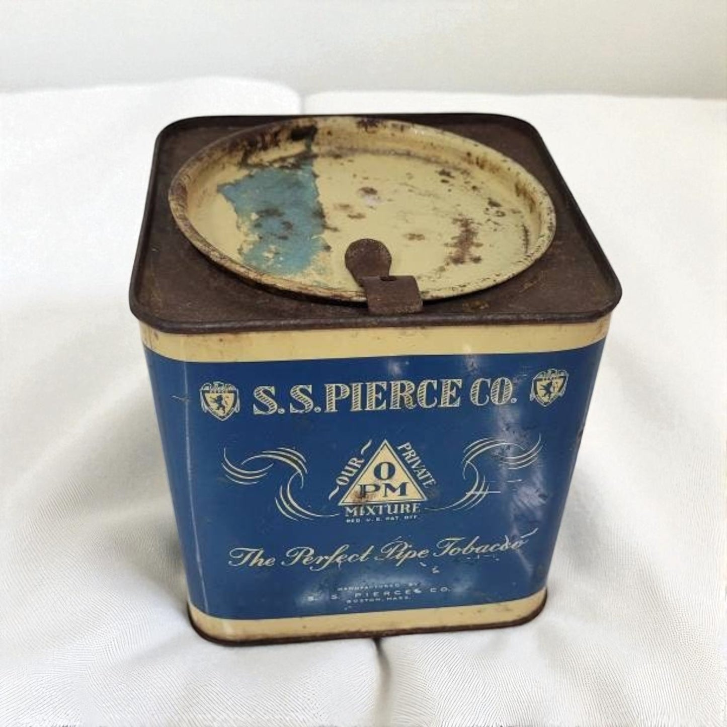 Vintage S.S. Pierce Co. tobacco tin on a white background