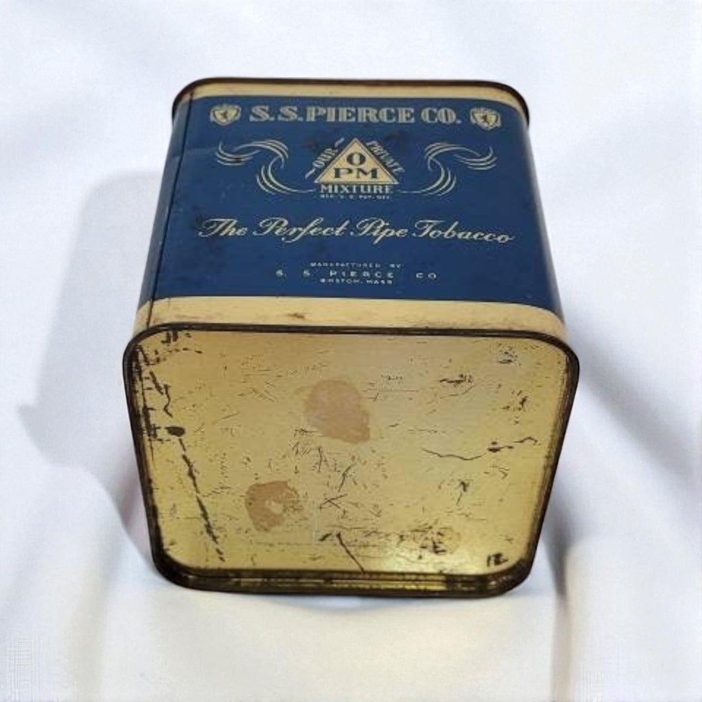 Vintage S.S. Pierce Co. tobacco tin on a white background