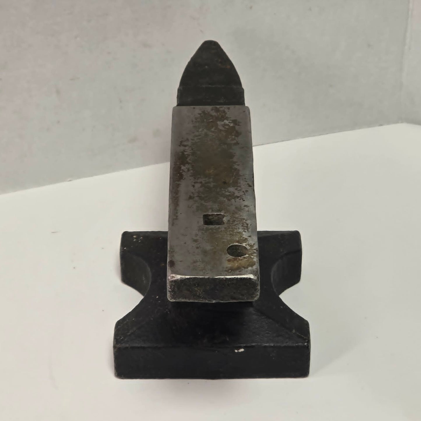 Vintage 22½ pound cast iron anvil with hardy hole and pritchel hole.