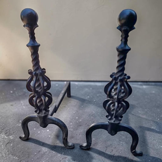 Pair of exquisitely ornate vintage wrought iron fireplace andirons.