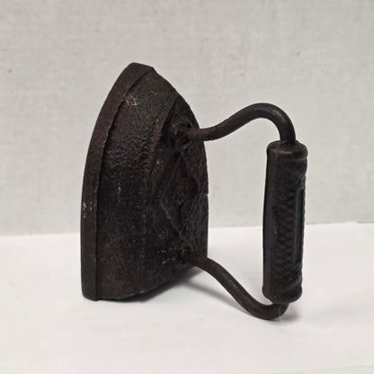 Antique Taylor Forbes No. 6 cast iron sad iron with diamond marking and patterned handle.
