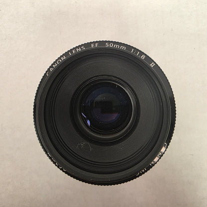 Canon camera lens on a beige background