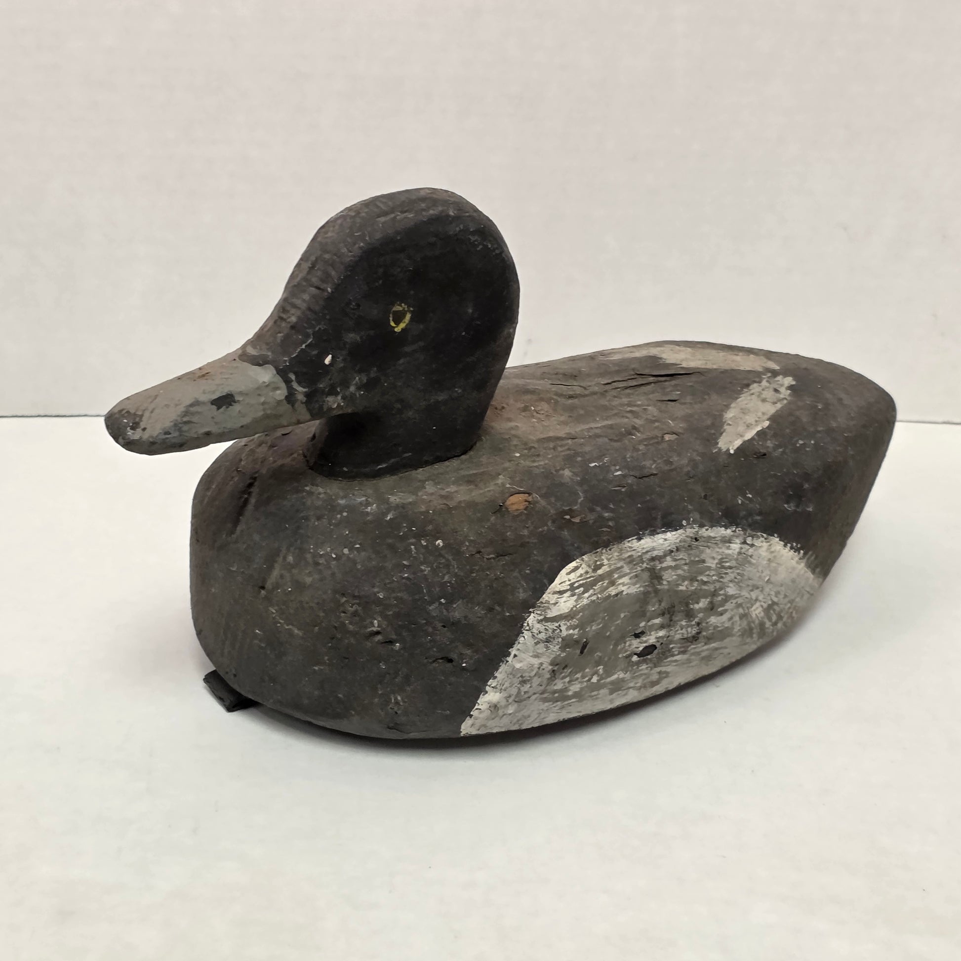 Decorative stone sculpture of a bird on a white background