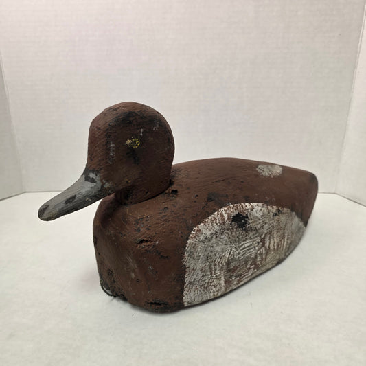 Wooden duck decoy on a white background