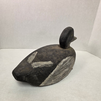 Wooden duck decoy on a white background