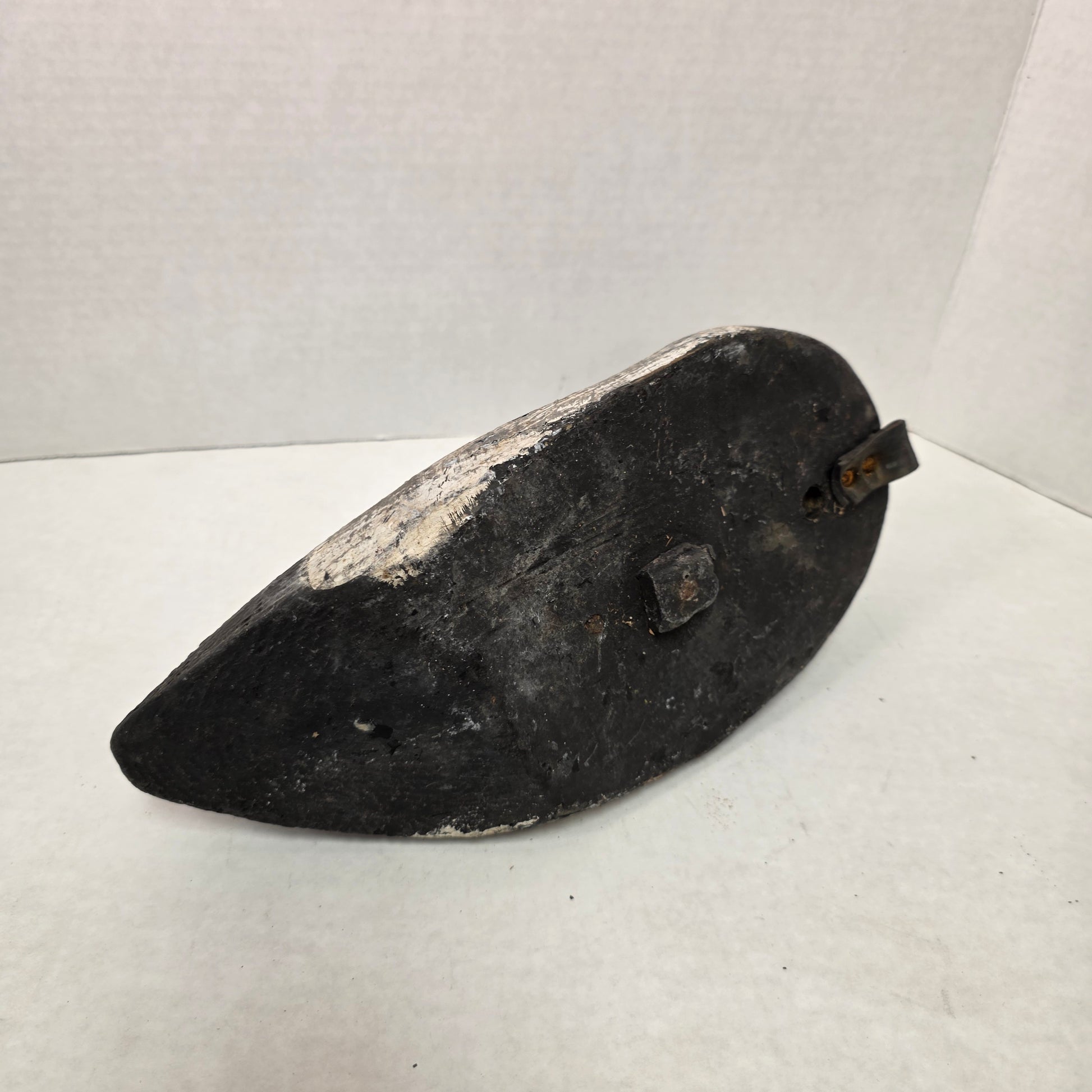 Wooden duck decoy on a white background