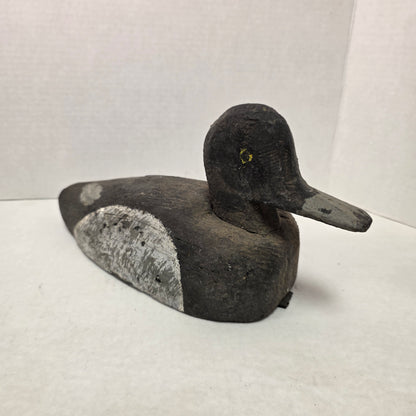 Wooden duck decoy on a white background