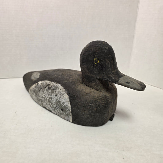 Wooden duck decoy on a white background