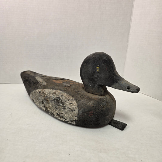 Wooden duck decoy on a white background