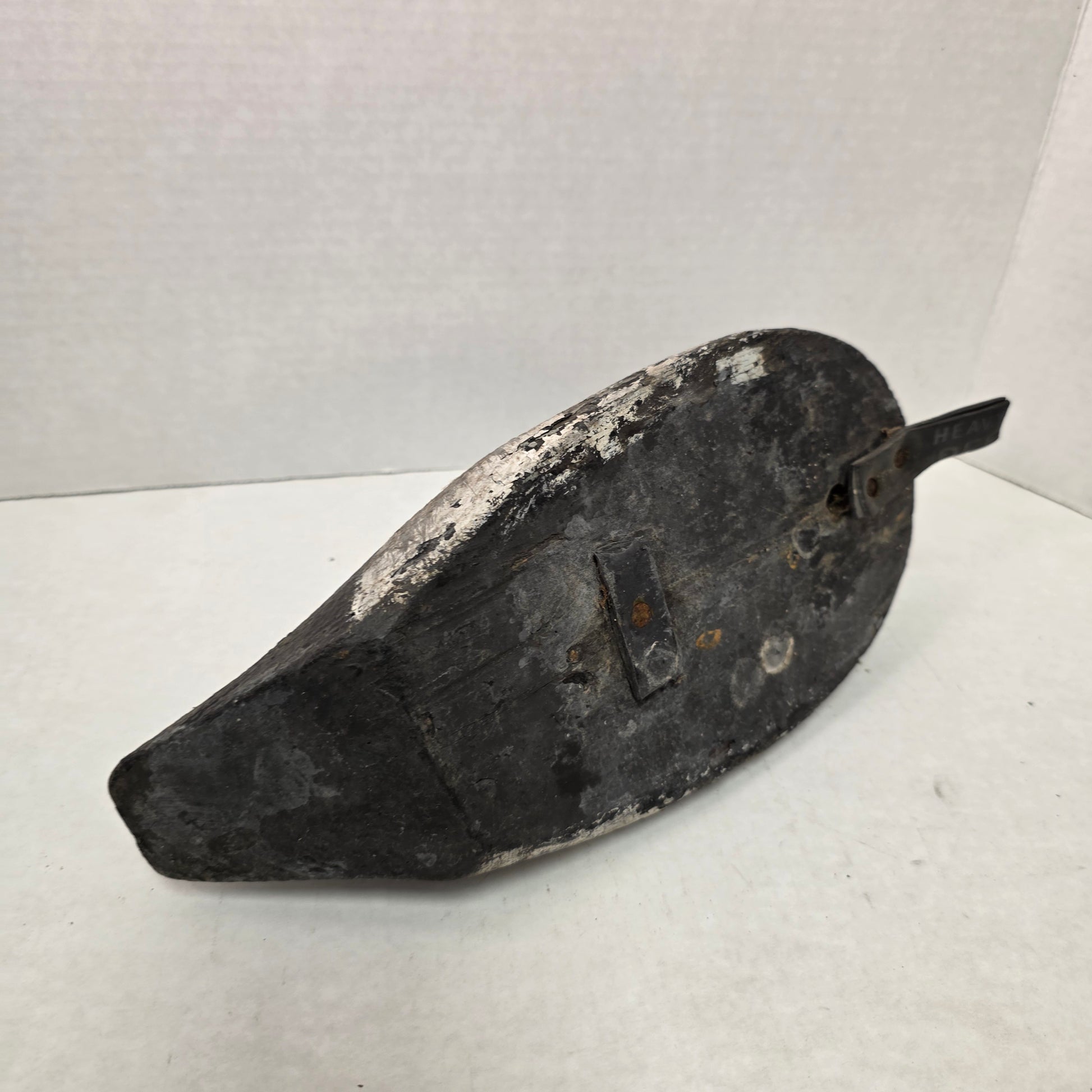 Wooden duck decoy on a white background