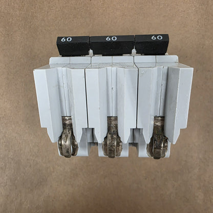 Electrical breaker panel with multiple circuit breakers on a brown background