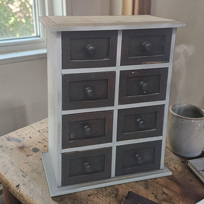 Vintage 8-drawer apothecary cabinet – compact and versatile home organizer.