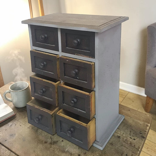 Vintage 8-drawer apothecary cabinet – compact and versatile home organizer.