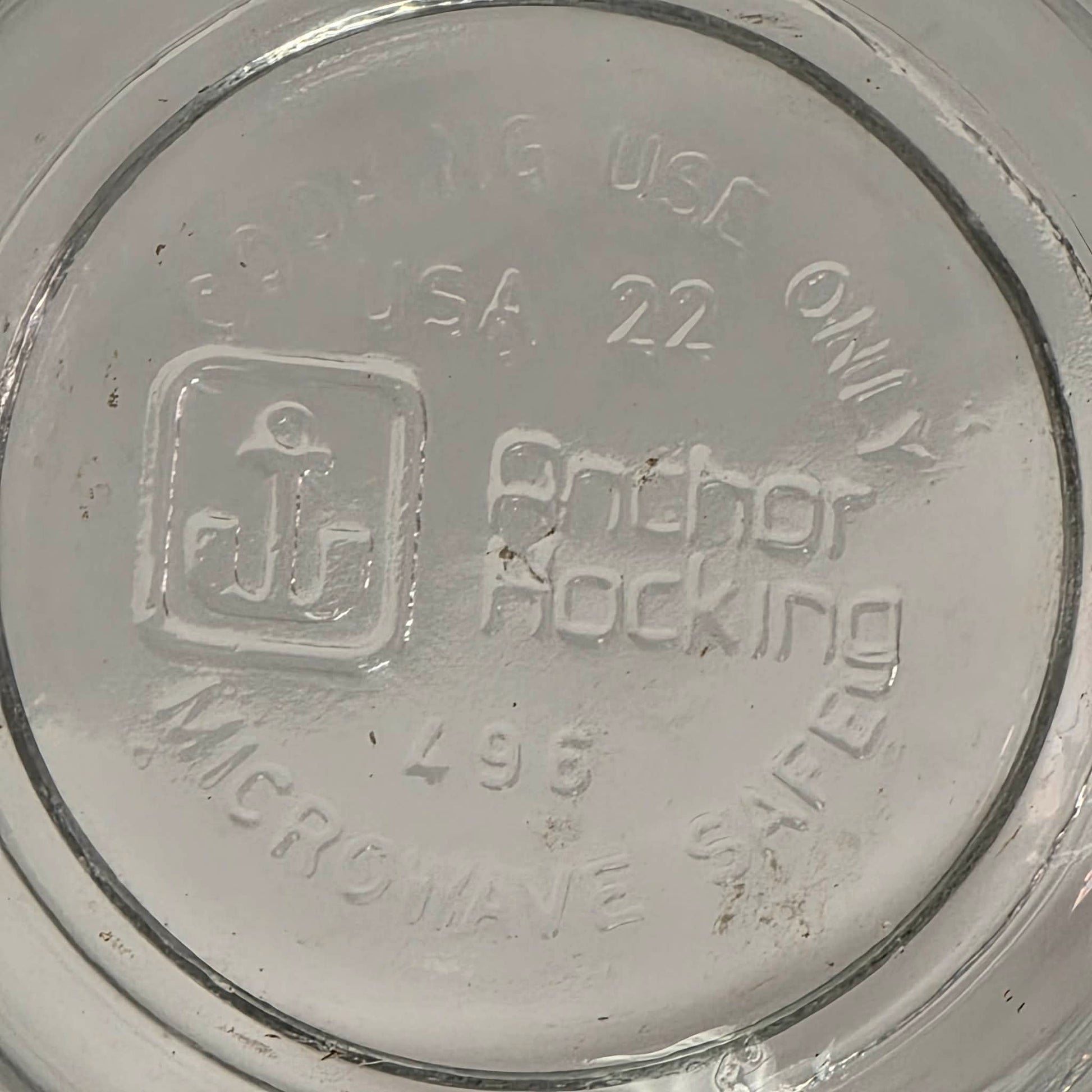 Vintage Anchor Hocking glass measuring cup with Imperial and metric measurements.
