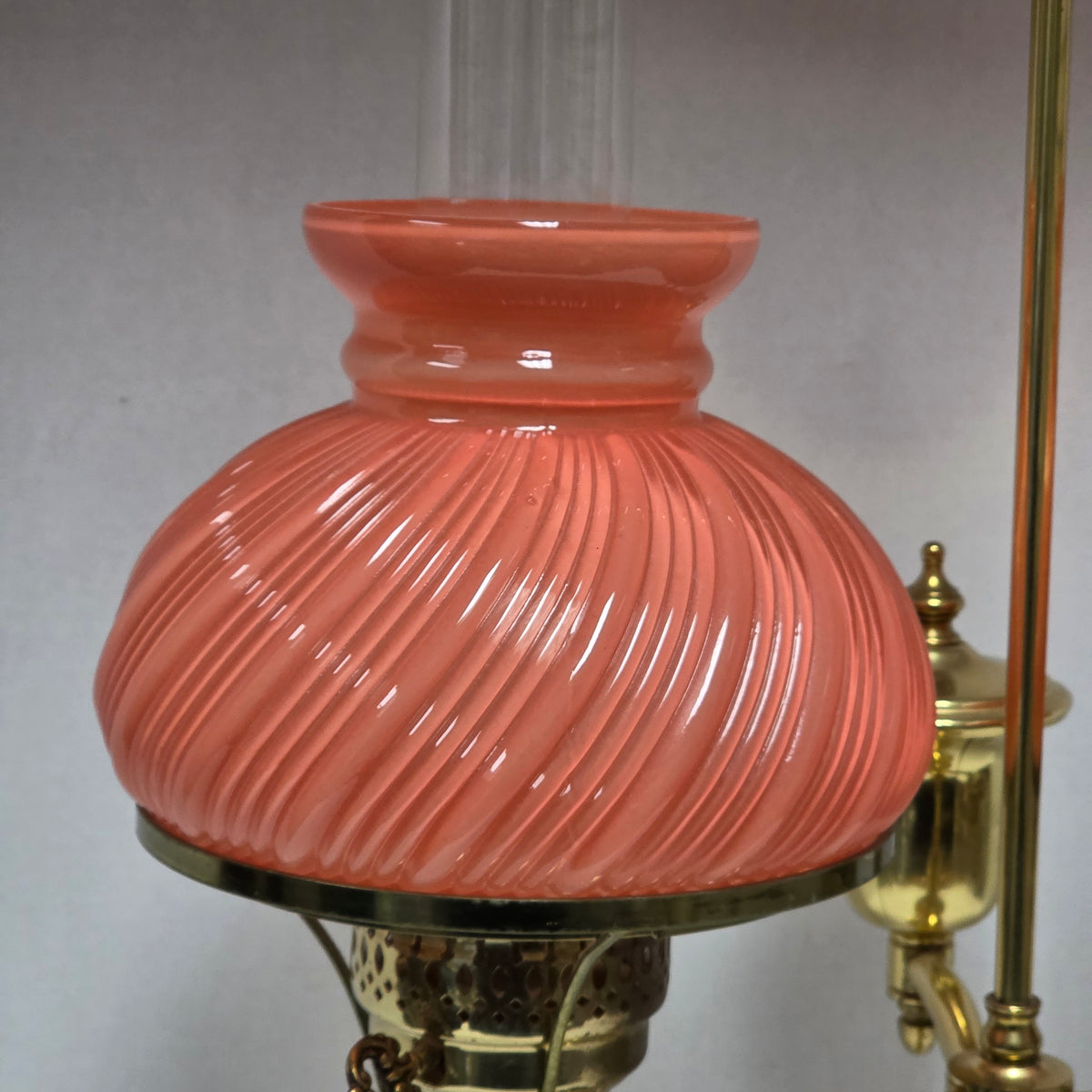Stunning Victorian brass lamp with pastel pink swirled glass shades.
