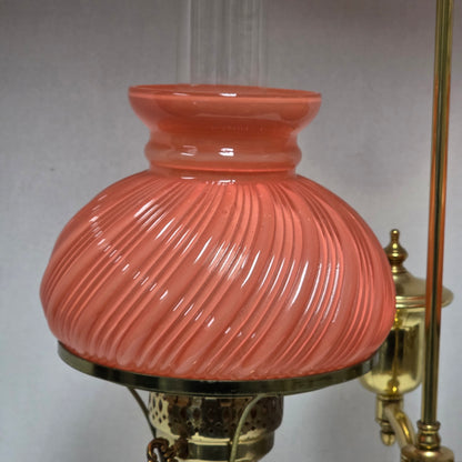 Stunning Victorian brass lamp with pastel pink swirled glass shades.