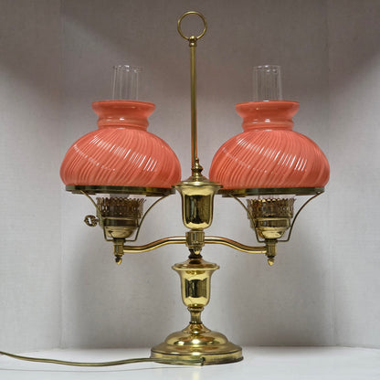 Stunning Victorian brass lamp with pastel pink swirled glass shades.