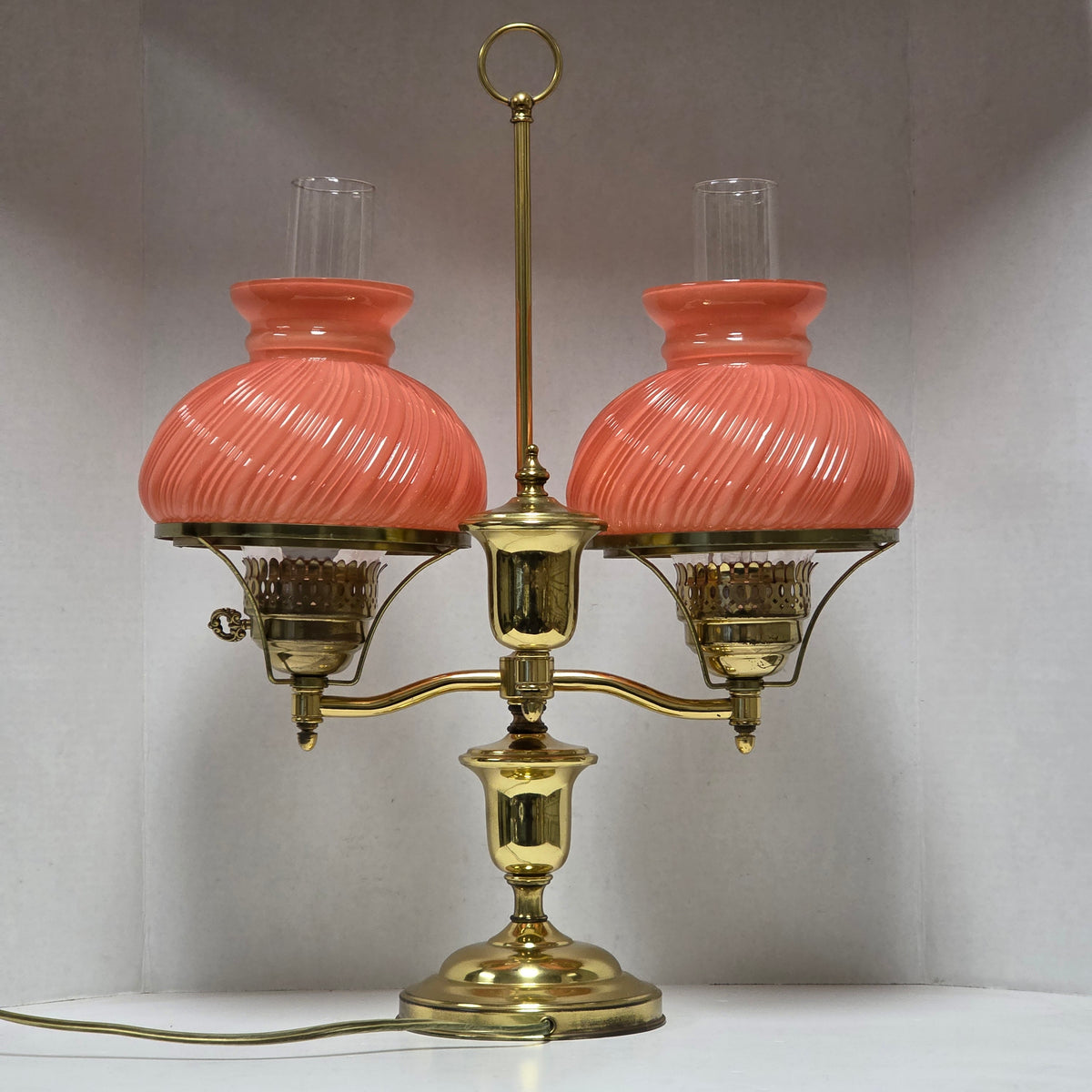 Stunning Victorian brass lamp with pastel pink swirled glass shades.