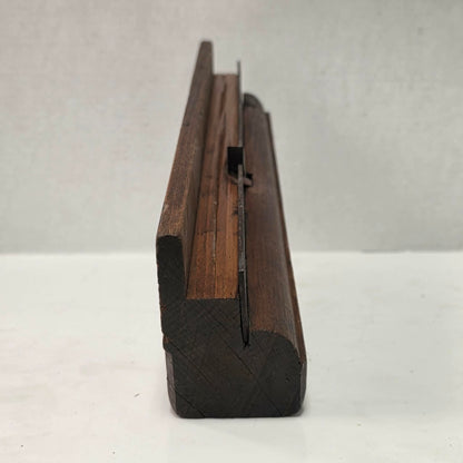 Antique wooden grooving plane with steel rail for tongue and groove woodworking.
