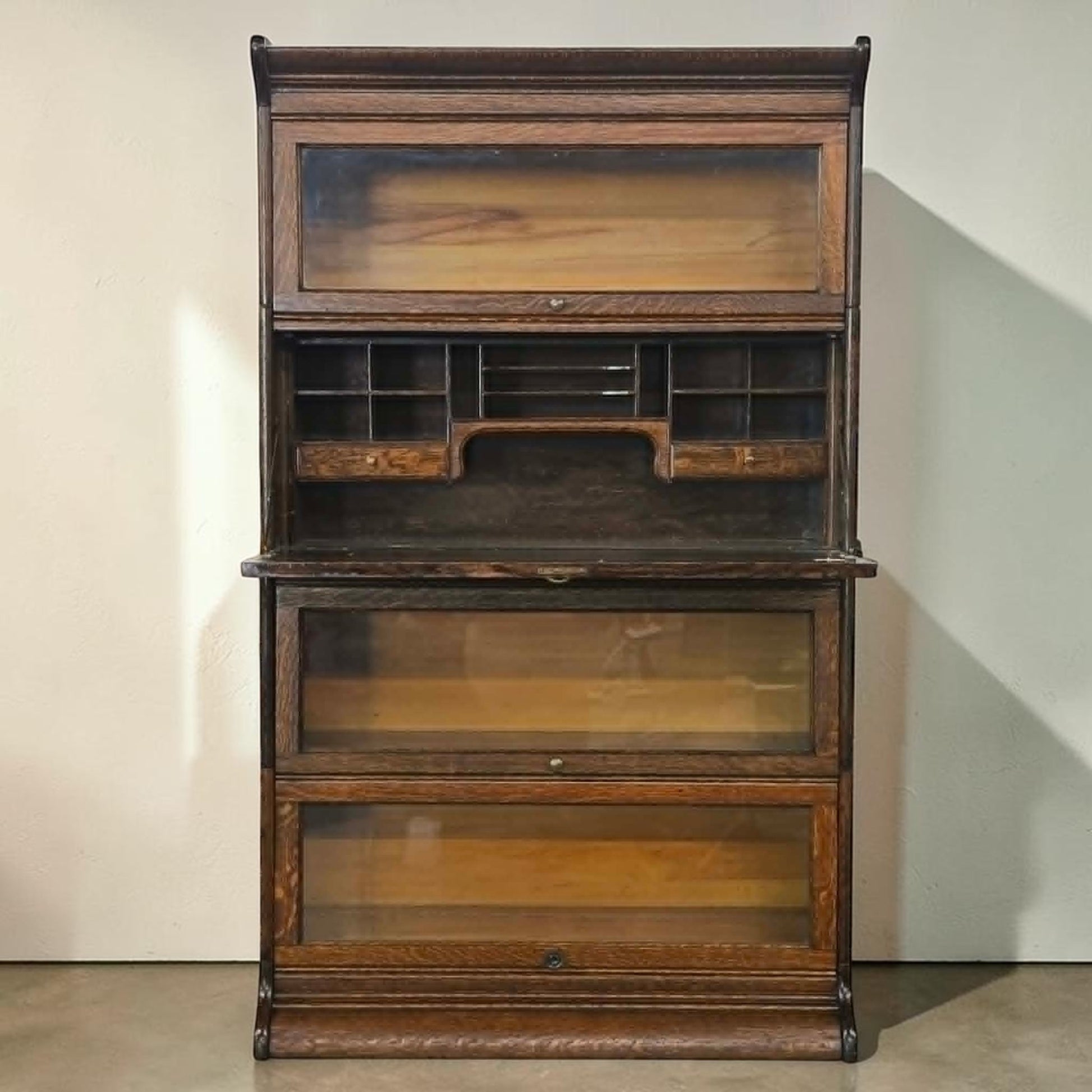 Antique quarter sawn oak barrister bookcase with fold-down writing desk.
